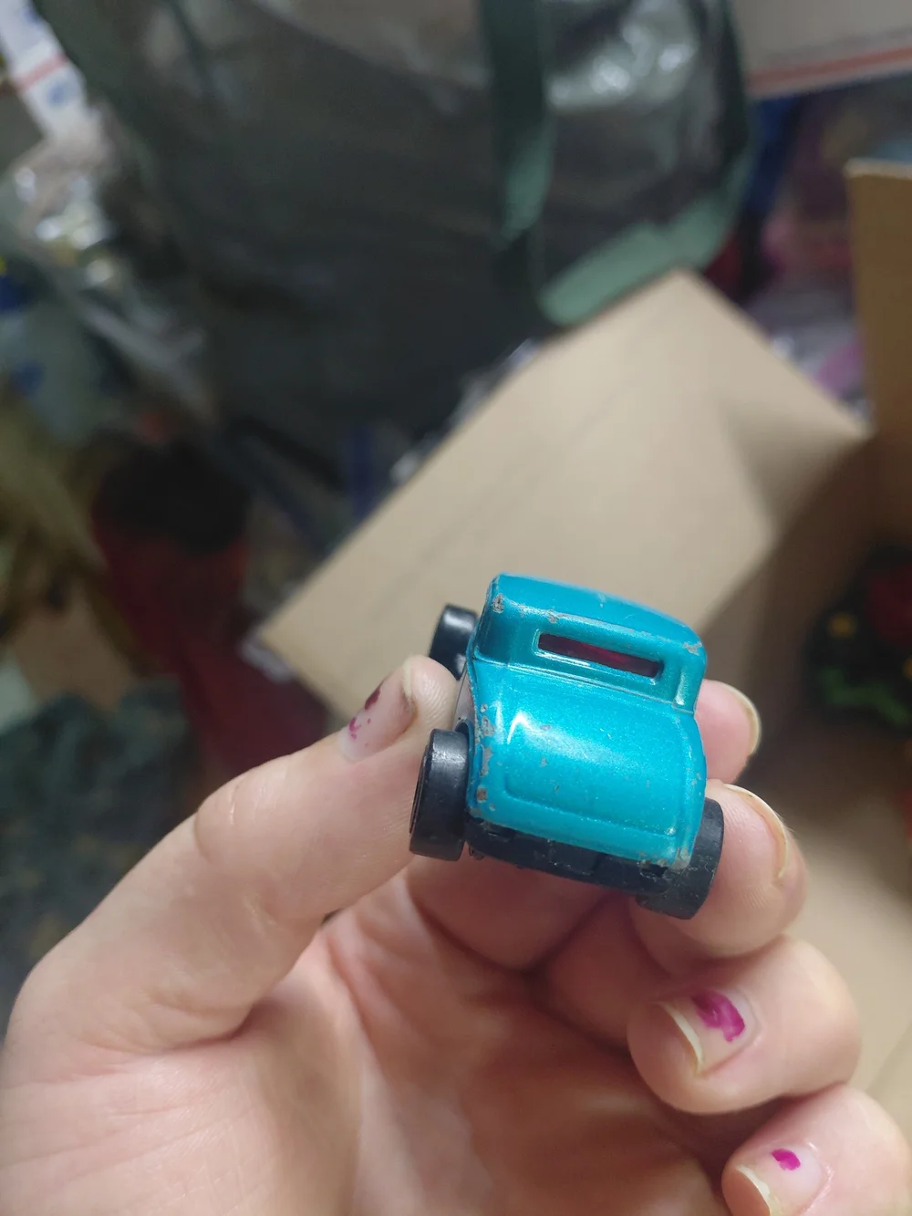 vintage 1997 Hot Wheels '32 Ford die-cast toy car in a light blue color.